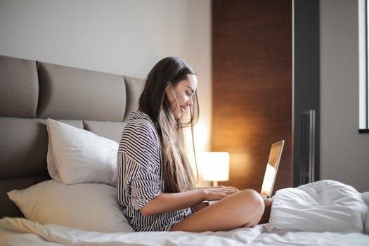 woman using a laptop in a cozy home office